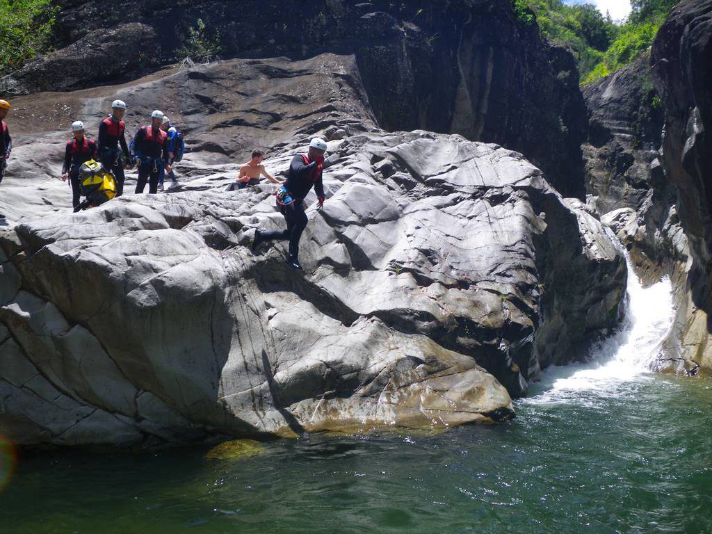 A jump in Trou blanc canyon, Reunion island, with an ADVENTURES REUNION canyoning guide